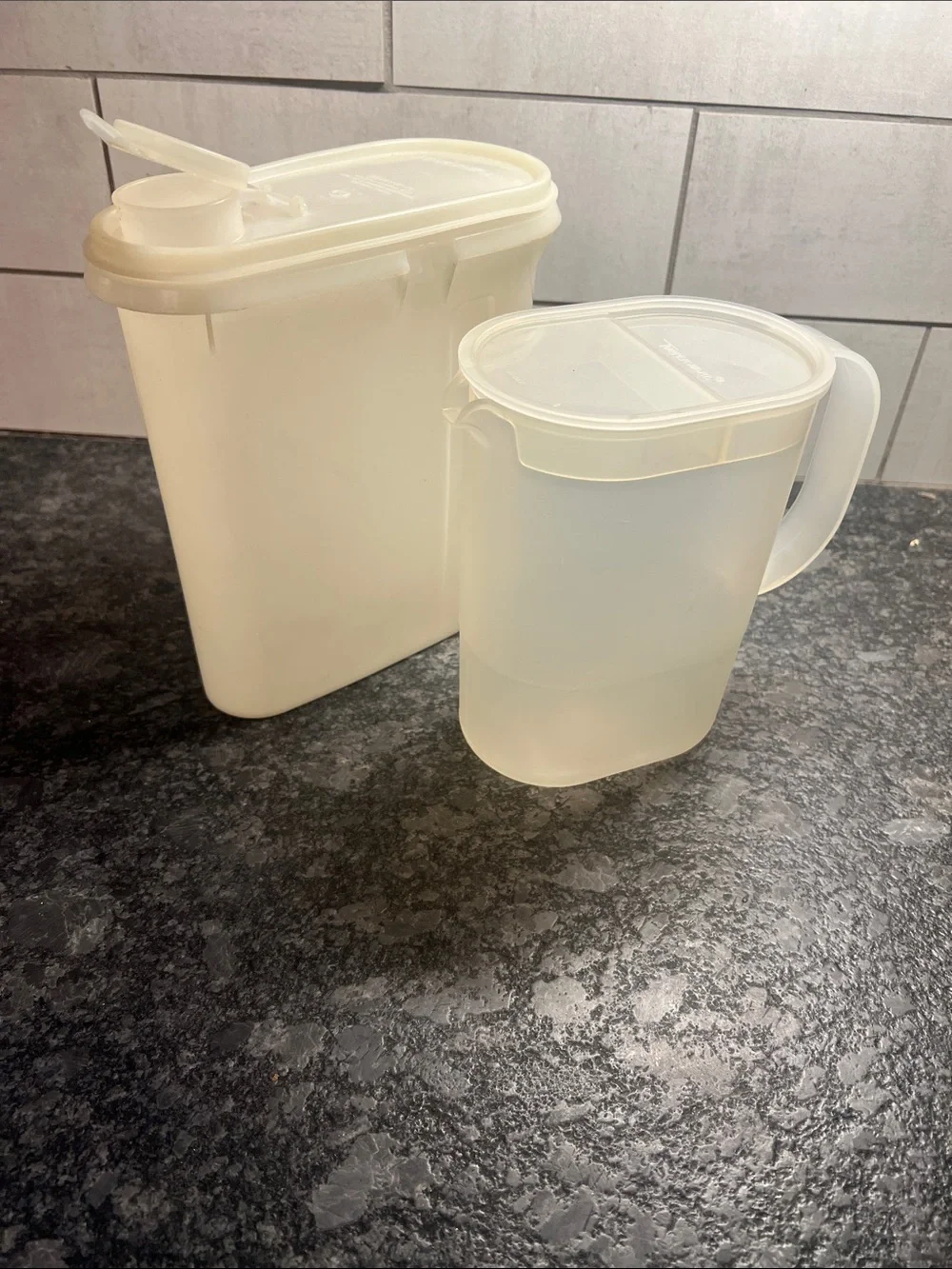 Tupperware 1 qt and a 2qt slim line beverage containers. Semi sheer Tight spaces